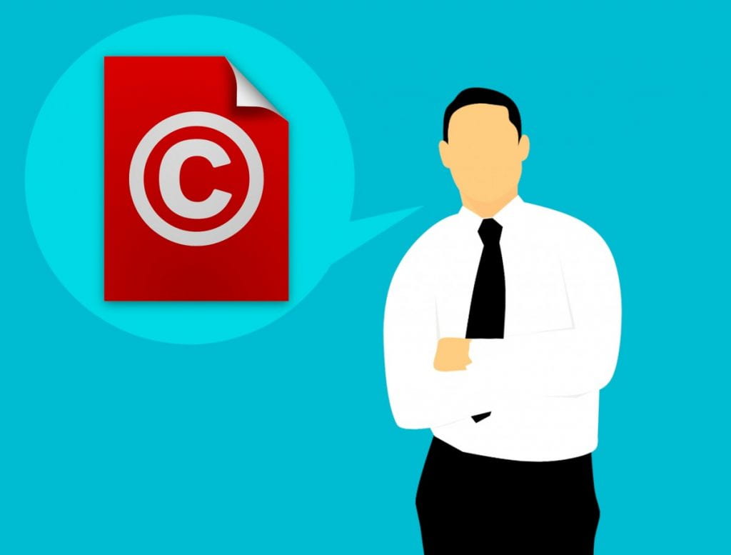 Cartoon image of a man with a speech bubble, containing a copyright icon